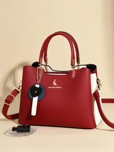 Fashion color-block women shoulder bag, elegant top handle handbag with cute heart charm.