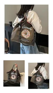 Japanese embroidered nylon tote bag, stylish casual shoulder bag with donut graphic and rope straps.