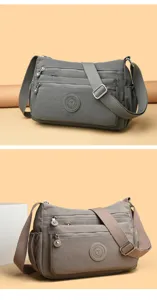 Nylon multi-pocket shoulder bag detail with durable zippers and adjustable strap.
