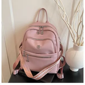 Pink leather fashion backpack for women, casual daily travel rucksack and commuting bag.