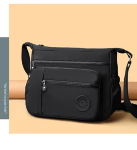 Detailed view of the multi-pocket nylon shoulder bag, showing durable fabric and zippers.