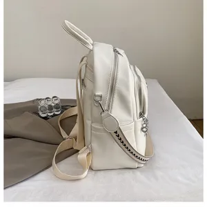 Side view detail of stylish white casual backpack for women, large capacity, PU leather.