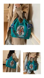 Fashion canvas shoulder bag for women, large capacity casual tote with chic embroidery design.