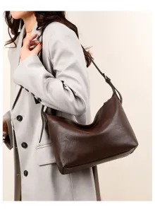 Retro brown leather women shoulder bag underarm dumpling handbag for casual daily commute.