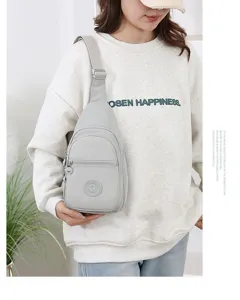 Casual nylon sling bag for women, lightweight solid color crossbody chest bag for daily travel.