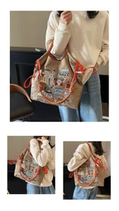 Large capacity canvas shoulder bag with Paris embroidery and orange rope handle detail.