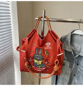 Casual large capacity canvas tote bag with cute rabbit embroidery, trendy shoulder handbag.
