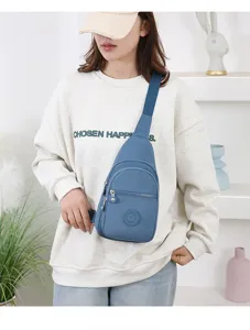 Stylish nylon sling bag for women, casual crossbody chest bag with front pocket and blue color.