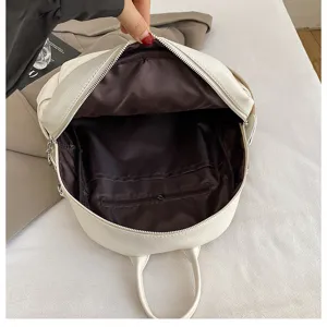 White leather women backpack detail interior compartment view stylish travel daily commute bag