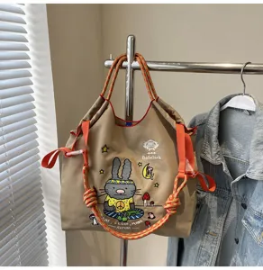 Large capacity canvas tote bag with cute rabbit embroidery, casual shoulder bag for daily use.