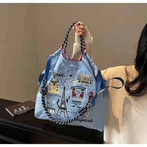 Blue large capacity embroidered tote bag with Paris theme landmarks and stylish strap design.