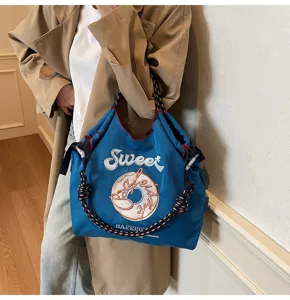 Casual nylon shoulder bag with sweet embroidery donut pattern, stylish daily tote bag.