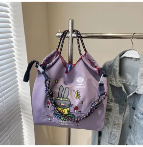 Purple canvas tote bag with cute cartoon rabbit embroidery, large capacity handbag.