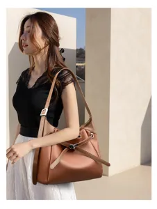 Minimalist soft leather shoulder bag for women, large capacity commuter tote and underarm style.