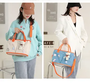 Large capacity mommy bag portable handbag stylish canvas diaper bag for mothers out use.