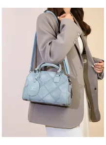 Blue quilted boston shoulder bag with top handle for women daily commute use detail