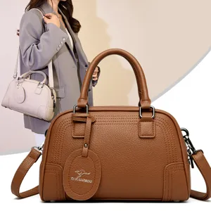 Stylish brown Boston handbag for women, PU leather shoulder bag for commuting daily use.