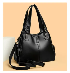 Black PU leather tote bag, large capacity shoulder handbag with crossbody strap and metal logo.