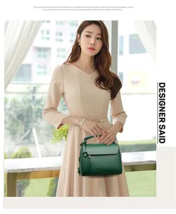 Elegant green leather handbag for women, stylish shoulder bag with top handle and metal hardware.