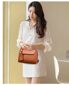 Elegant orange leather women handbag, soft material shoulder crossbody bag for daily use.