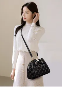 Elegant black rhinestone shell handbag detail view, stylish commuter crossbody design.