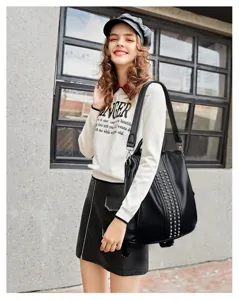 Fashion women shoulder backpack with metal rivets, casual leather travel daypack for daily wear.