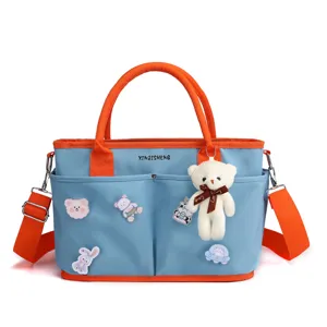 Large capacity diaper bag mom tote canvas baby bag with cute bear pendant and blue orange design