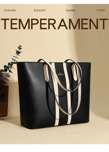 Detailed view of women large capacity tote bag, fashion black and white contrast design for daily use.