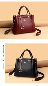 Lederhandtasche Detail zeigt ein eleganteres Premium-Textur, Metallkettenanhänger.