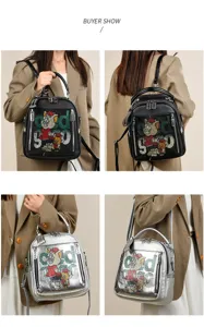 Soft leather women's backpack with sparkling rhinestone cartoon details and stylish design.