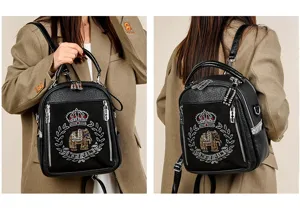 Stylish black soft leather backpack for women with rhinestone elephant crown design detail.