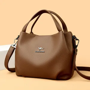 Brown leather handbag for women, stylish crossbody bag with top handle and large capacity.