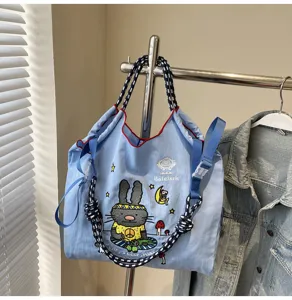 Casual blue canvas tote bag with cute rabbit embroidery, large capacity shoulder bag for women.