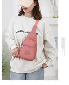 Minimalist nylon chest bag for women, lightweight solid color crossbody sling bag detail view.