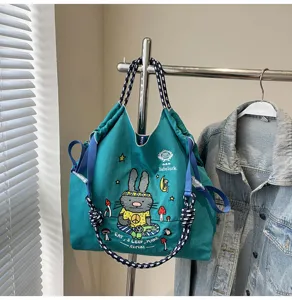 Casual canvas tote shoulder bag with cute rabbit embroidery and large capacity for daily wear.