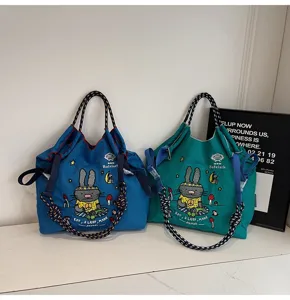 Casual large capacity canvas tote bag with cute rabbit embroidery and thick rope handles.