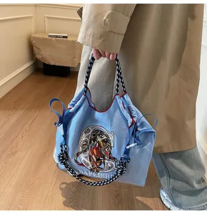 Casual embroidered canvas shoulder bag, large capacity stylish tote for daily commuting.