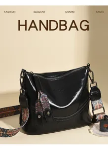 Retro black wax leather women shoulder bucket bag with ethnic wide strap and chic tassel charms.