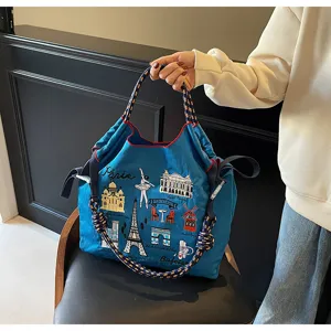 Detail view of large capacity nylon tote bag with Paris embroidery and braided rope handles.