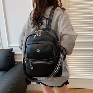 Large capacity black leather backpack for women, stylish travel and daily casual commuting bag.