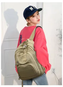 Casual nylon multi-pocket backpack for students, stylish large capacity travel school bag.