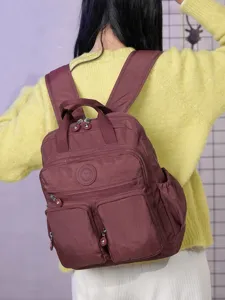 Zaino in nylon elegante da donna, grande capacità borsa da viaggio con tasche.