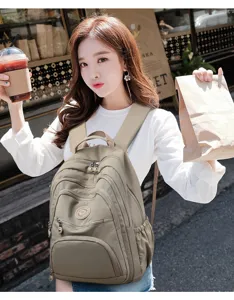 Casual canvas backpack for women students, multi-pocket school bookbag stylish daily.