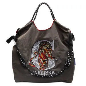 Large capacity canvas shoulder bag with stylish lion embroidery and rope handles.