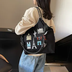 Large capacity nylon tote bag with creative travel embroidery design for women daily use.