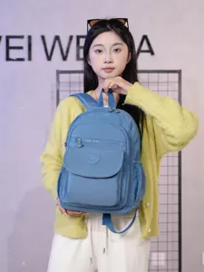 Casual nylon backpack for women, daily travel school book bag with multiple pockets.