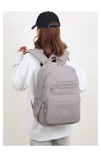 Zaino casual grigio multitasche, borsa scolastica leggera per donne e studenti.