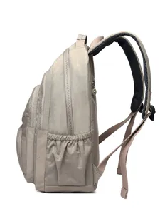 Beige nylon backpack side view showing multi-pocket design, durable daily school bookbag.