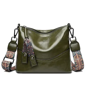 Retro women's leather shoulder bag casual bucket crossbody handbag with wide ethnic strap.