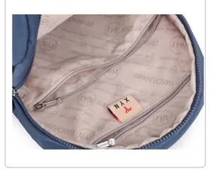 Detailed view of the backpack interior showing smooth lining, secure zipper pocket and branded label.
